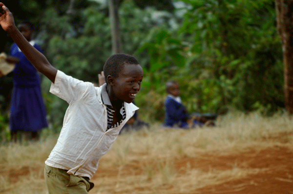 schoolchild from the Shimbe Chini school plays soccer