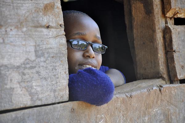 School child from Tanzania looking in the landscape